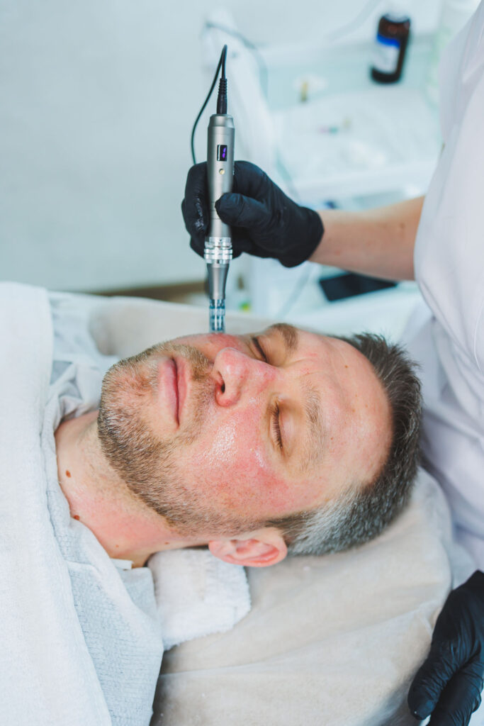 Male cosmetology. A man lies at a cosmetologist for a facial treatment.