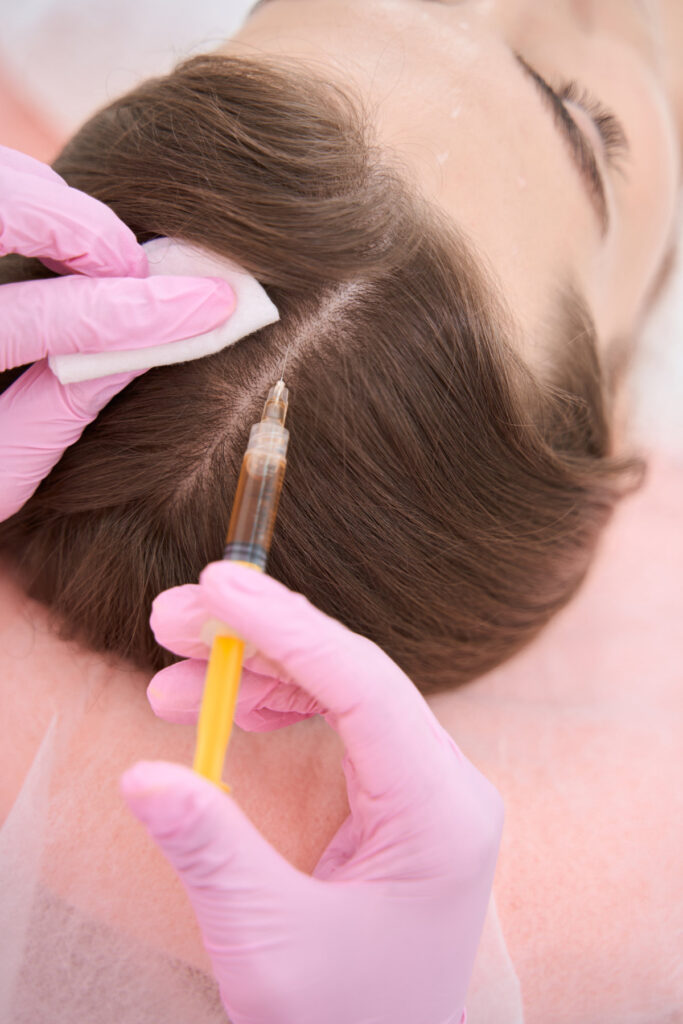 Syringe is injected subcutaneously on the skin of a head